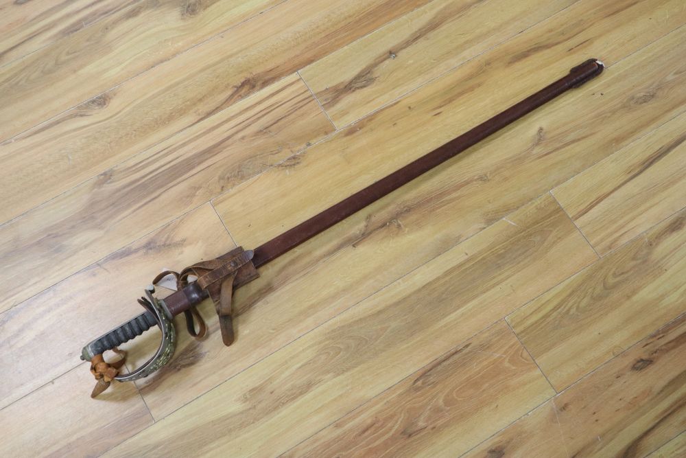 A 1912 Pattern Cavalry sword ER II, shagreen grip and 94cm etched, single edged blade, leather scabbard